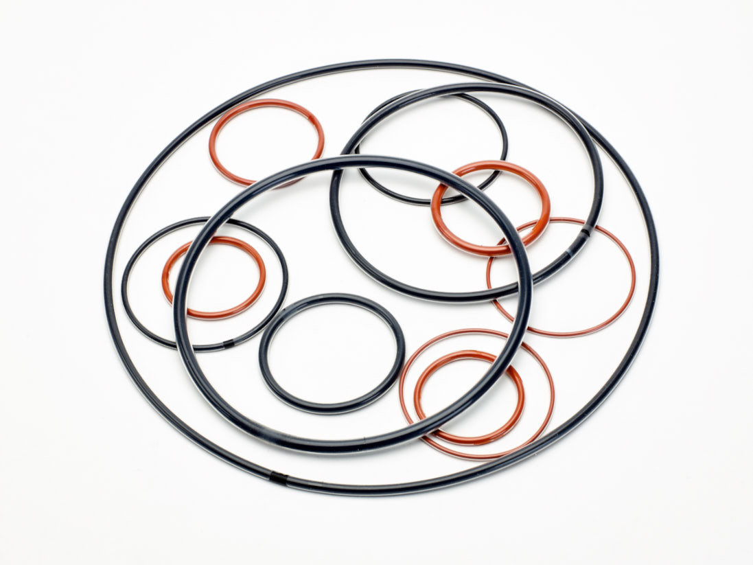 An arrangement of FEP Encapsulated O-Rings on a white background.